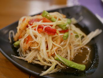 Close-up of pasta served in plate on table