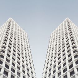 Low angle view of skyscrapers against clear sky