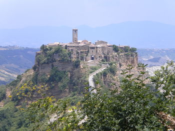 Scenic view of hill against sky