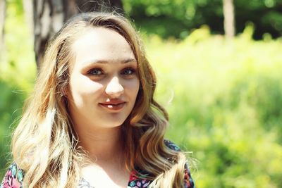 Portrait of young woman at park