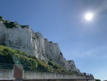 Low angle view of mountain against clear blue sky