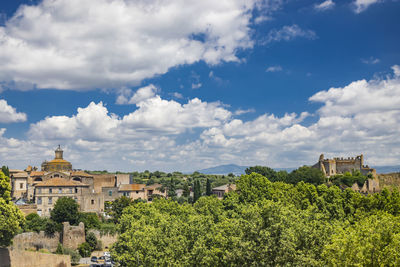 Buildings in city against sky