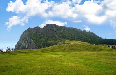 Scenic view of landscape and mountains against sky