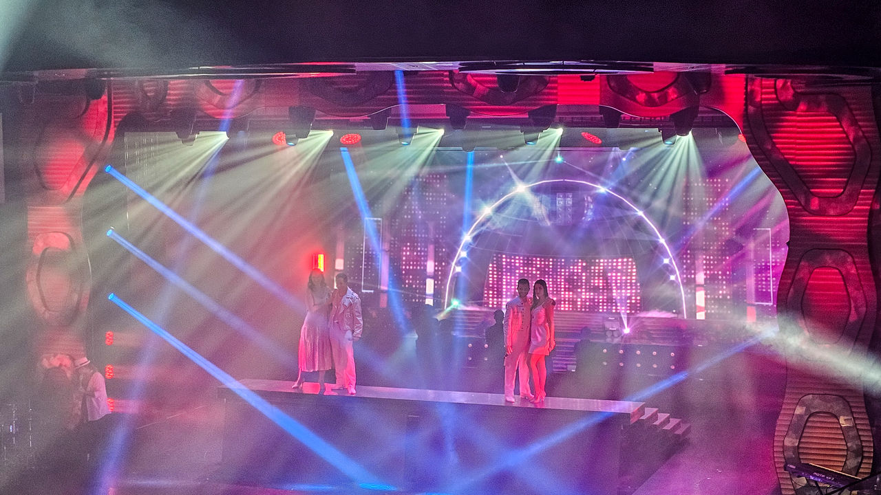 stage, arts culture and entertainment, performance, music, night, enjoyment, performing arts, crowd, concert, event, rock concert, entertainment, group of people, disco, illuminated, nightlife, lighting equipment, musical theatre, occupation, nightclub, adult, indoors