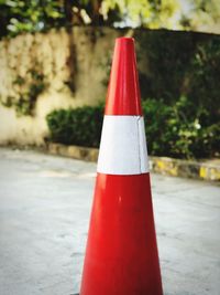 Close-up of red umbrella on road