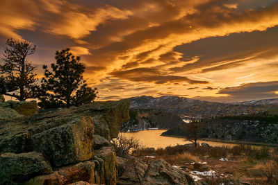 Scenic view of landscape against sky during sunset