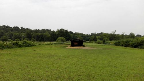 Built structure on field against clear sky