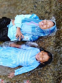 High angle view of siblings and woman