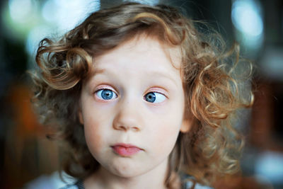 Close-up portrait of cute girl making face