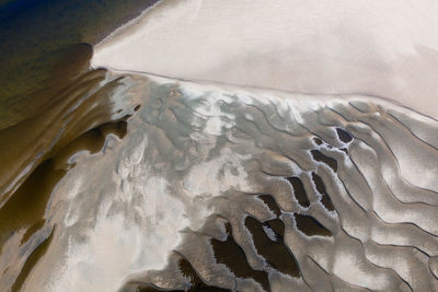 Aerial view of beaches and sand patterns at river karasjohka at the border of finland and norway