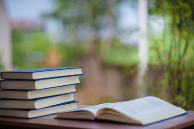 Stack of books on table at home