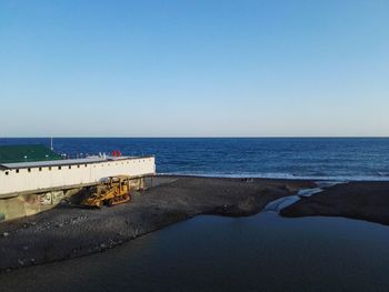 Scenic view of sea against clear blue sky