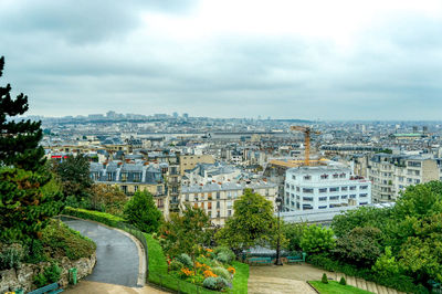 High angle view of street amidst buildings in city