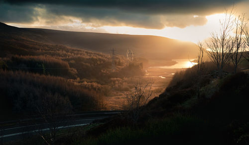 Scenic view of landscape against sky during sunset