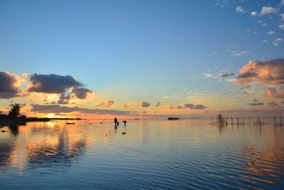 Scenic view of lake against sky during sunset