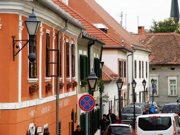 People on street against buildings