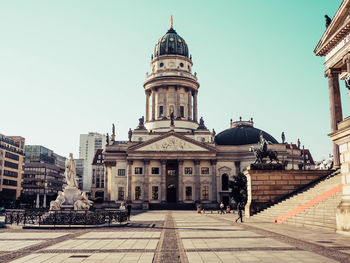 View of buildings in city against clear sky