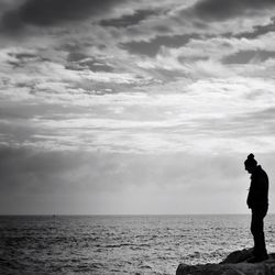 Scenic view of sea against cloudy sky