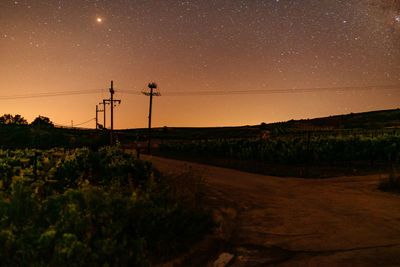 Scenic view of landscape against sky at night