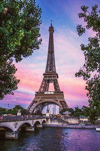 Eiffel tower against sky during sunset
