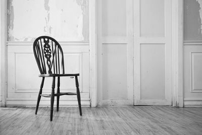 Empty chairs and table in building