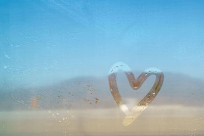 Close-up of heart shape in water