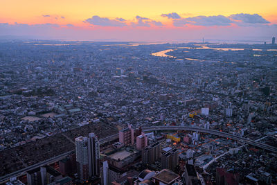 High angle view of city during sunset