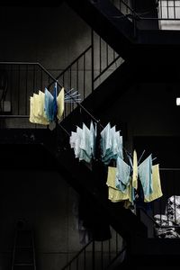 Low angle view of clothes drying on railing against building