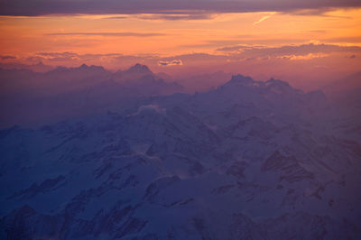 Scenic view of mountains against sky during sunset