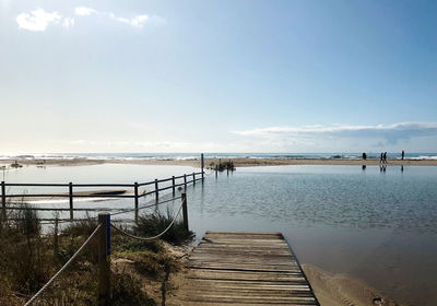 Pier over sea against sky