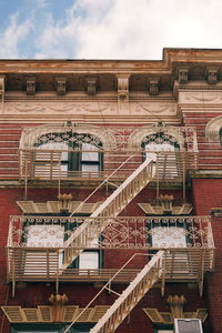 Low angle view of staircase in building against sky