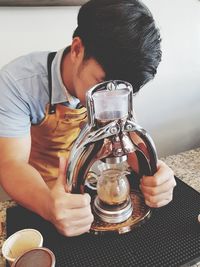 Midsection of man holding ice cream