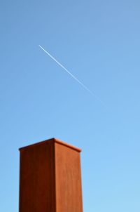 Low angle view of vapor trails in sky