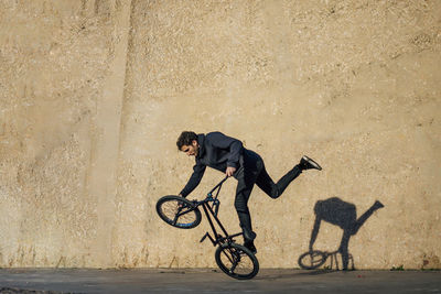 Man practicing tricks with the bmx bike in the city