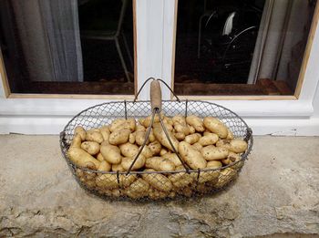 Close-up of bread in basket on glass window