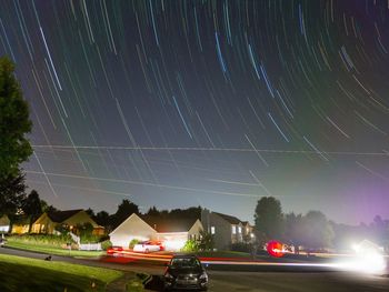 Light trails against sky at night