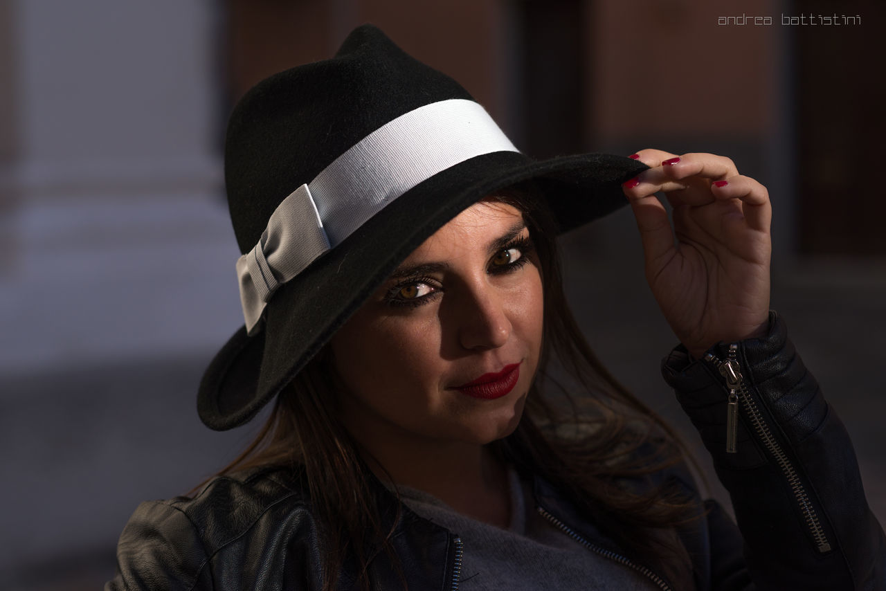 PORTRAIT OF YOUNG WOMAN IN HAT