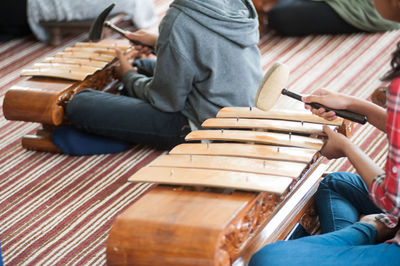 Low section of people playing gamelan