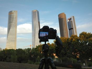 Low angle view of modern buildings against sky