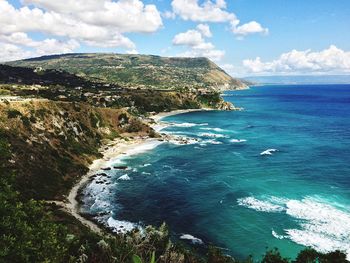 Scenic view of sea against cloudy sky