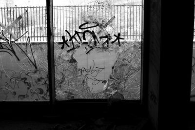 Close-up of graffiti on window