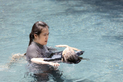 Full length of woman swimming in water