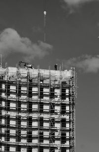 Low angle view of buildings against sky in city