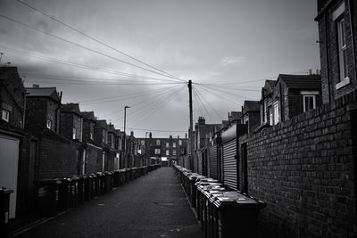 Street amidst buildings against sky