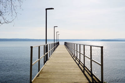 Pier on sea against sky