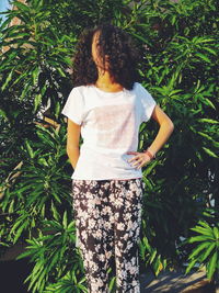 Woman in front of plants in park