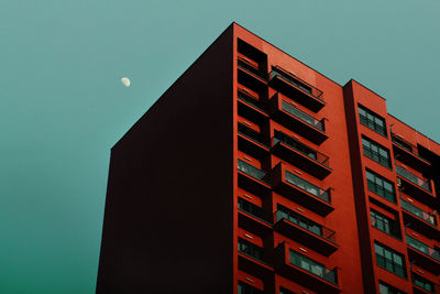 Low angle view of building against blue sky at dusk