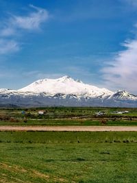 Scenic view of snowcapped mountains against sky