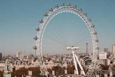 Low angle view of ferris wheel against sky