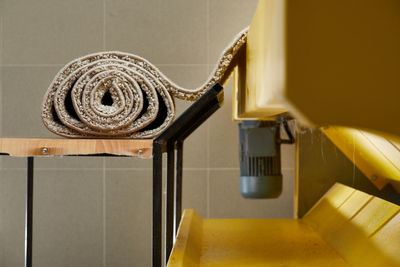 Close-up of machine part on table at home